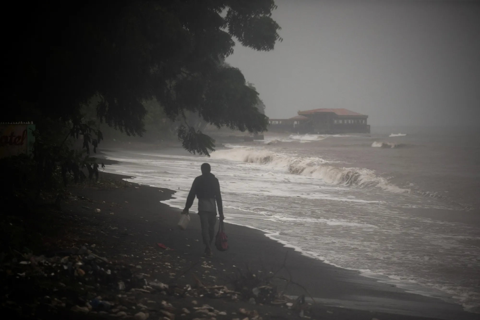 A man walks along the beach following Hurricane Melissa in Petit-Goave, Haiti on Oct. 30.