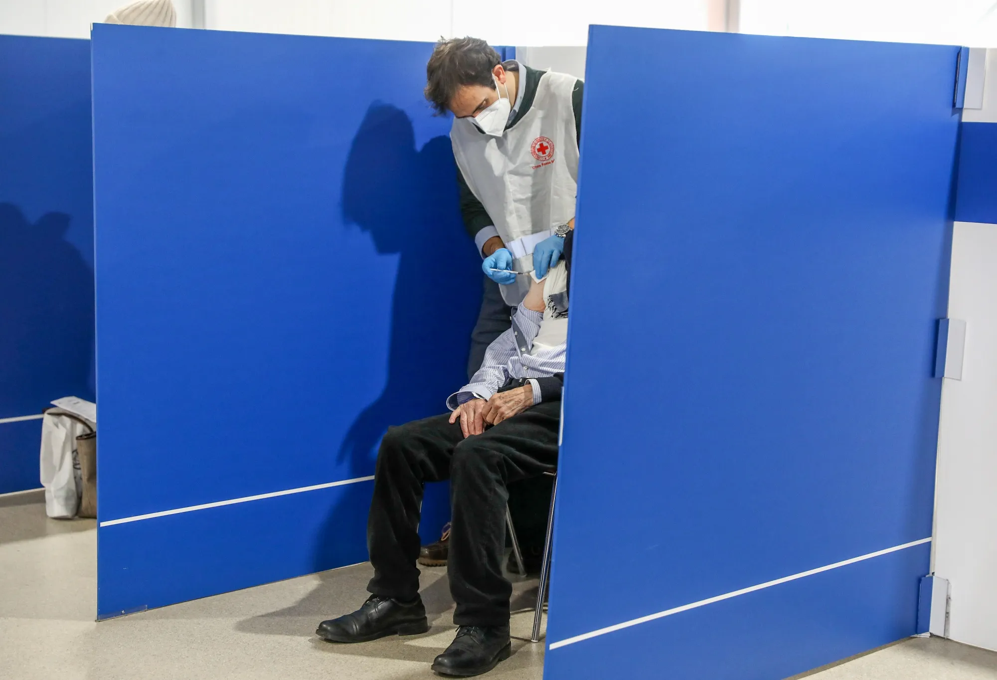 A health worker administers a Covid-19 vaccine at a vaccination center in Rome, in 2021.