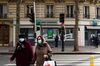 Pedestrians in protective face masks pass a BNP Paribas SA bank branch in Paris, France, on Tuesday, Nov. 3, 2020.