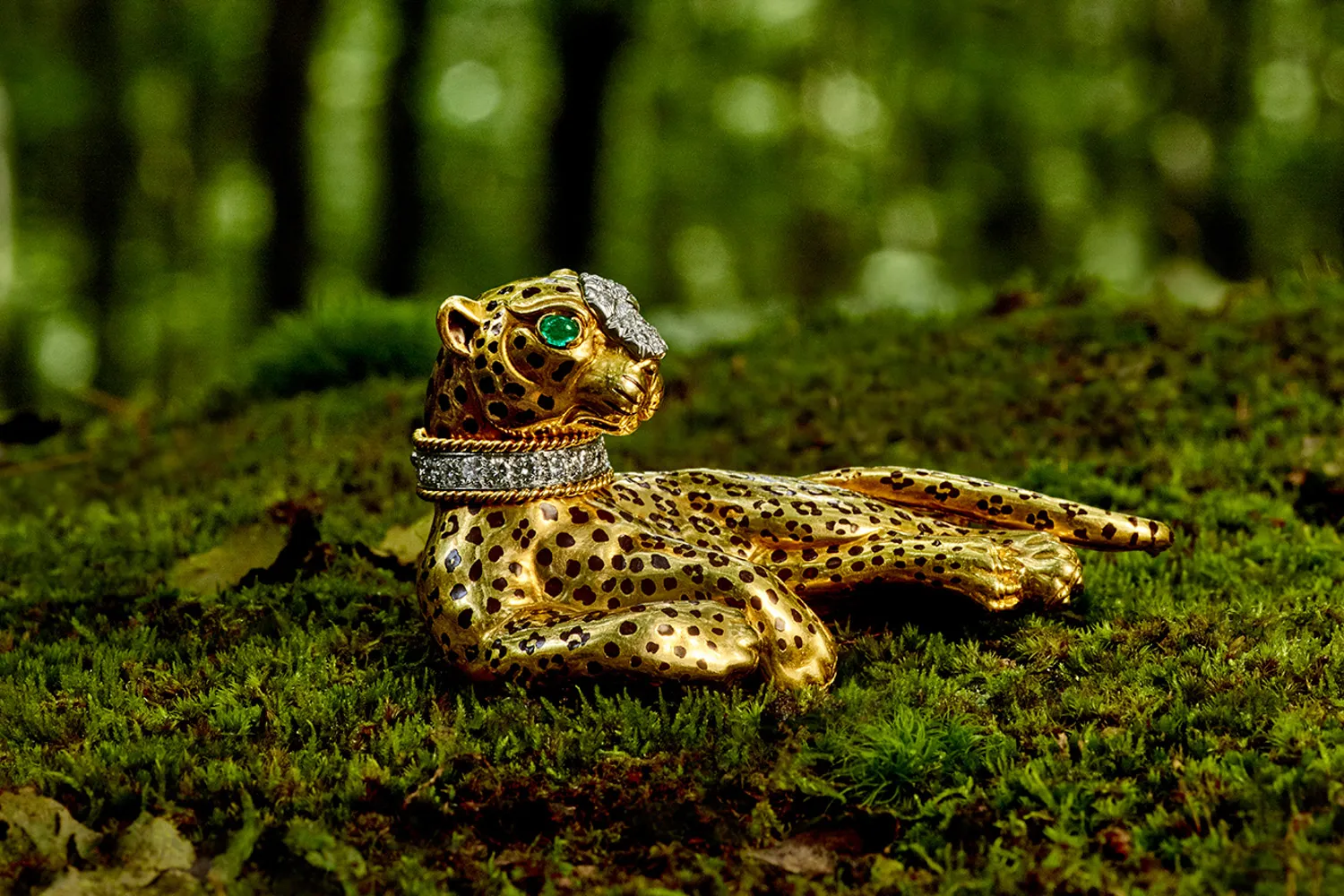 Lounging leopard brooch.