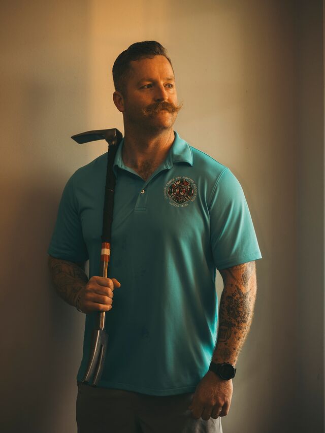 Max Walsh, the off-duty firefighter who rescued Venkateswara Pasumarti and Susmita Maddi, holding an extraction tool at his house in Virginia on Aug. 21.