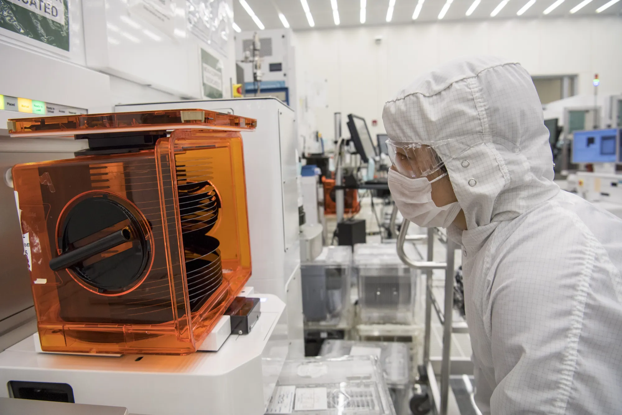 A technician checks on a stack of wafers at the Applied Materials facility in Santa Clara, California.