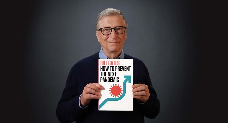 Microsoft co-founder Bill Gates holding a copy of his book, “How to Prevent the Next Pandemic.”