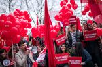 People from the Social Democrats in Sweden march during a rally in Stockholm on May 1.