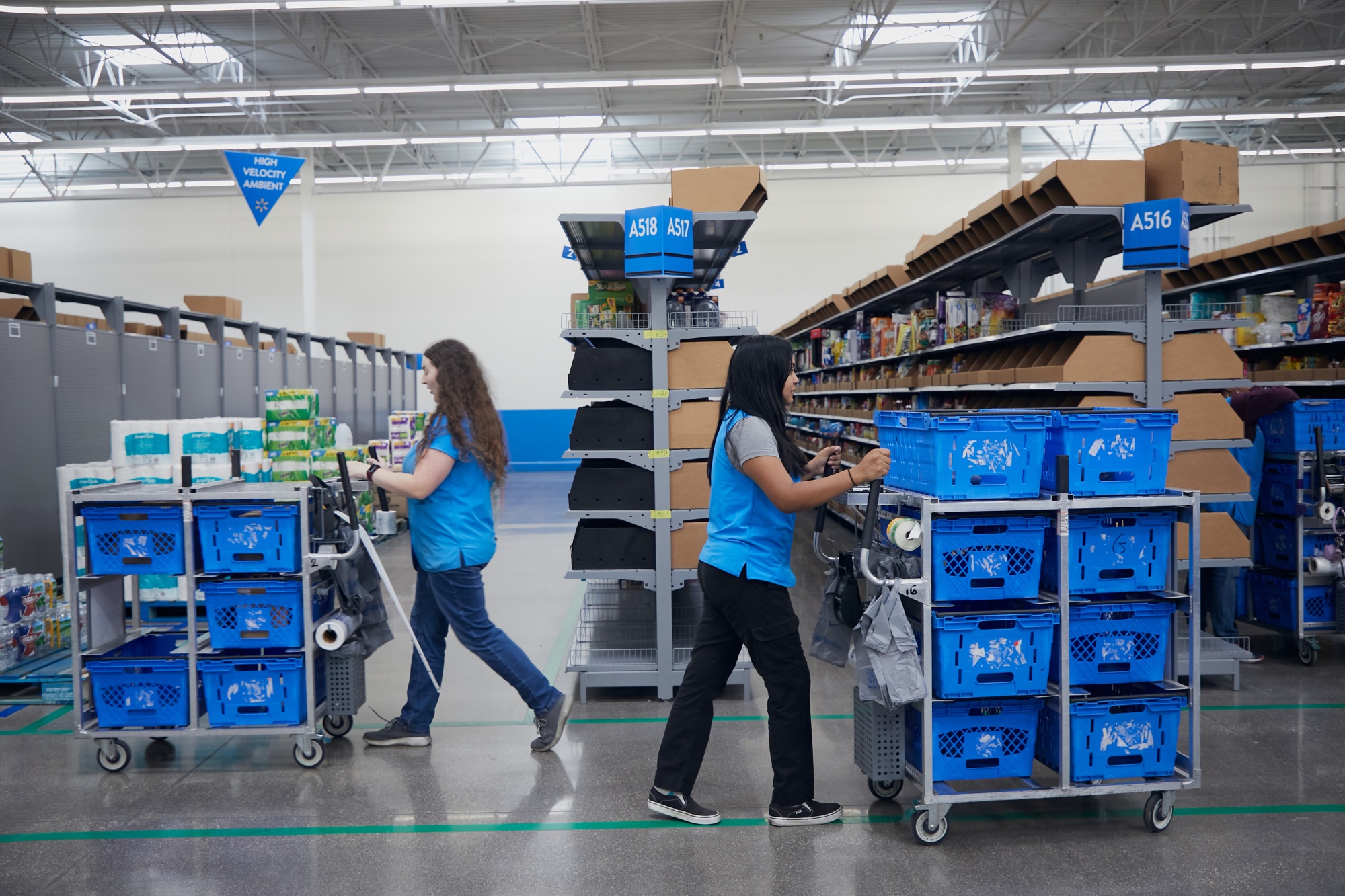 Employees gather online orders at a Walmart market fulfillment center in Grapevine, Texas.