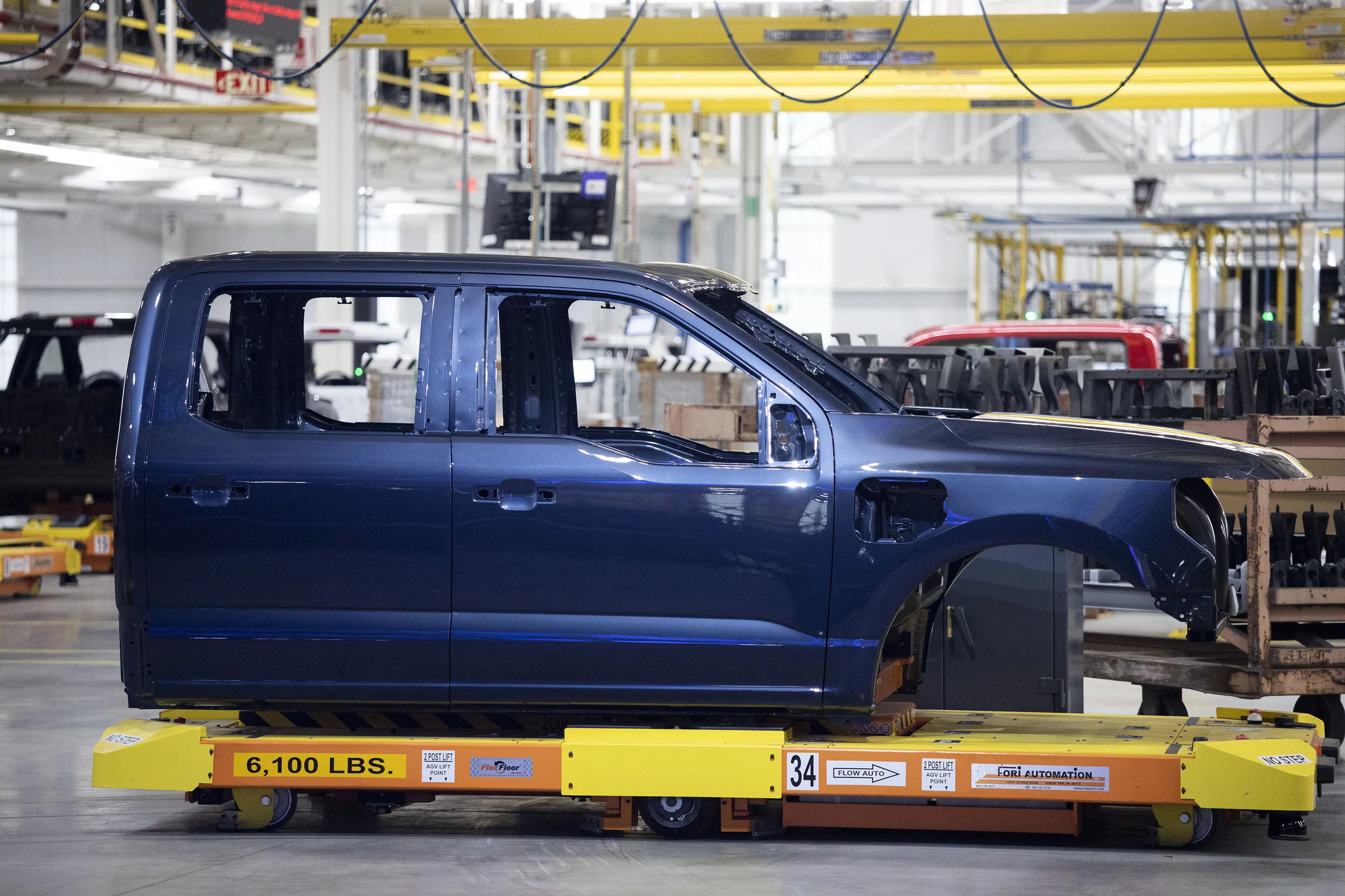 Ford is cutting a shift at a Michigan plant where it makes the F-150 Lightning electric pickup.