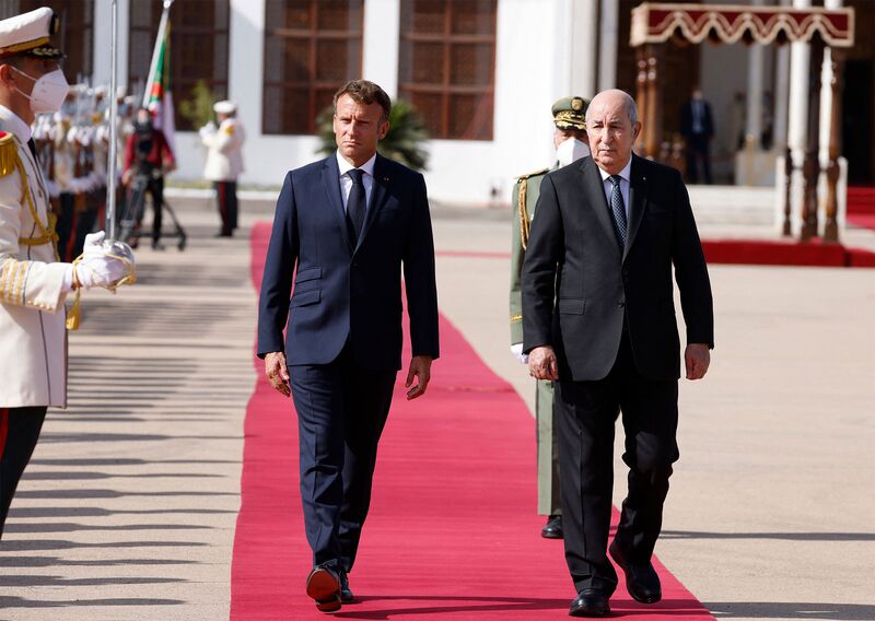 French President Emmanuel Macron, left, and Algeria's President Abdelmadjid Tebboune in Algiers, on Aug. 27, 2022. 