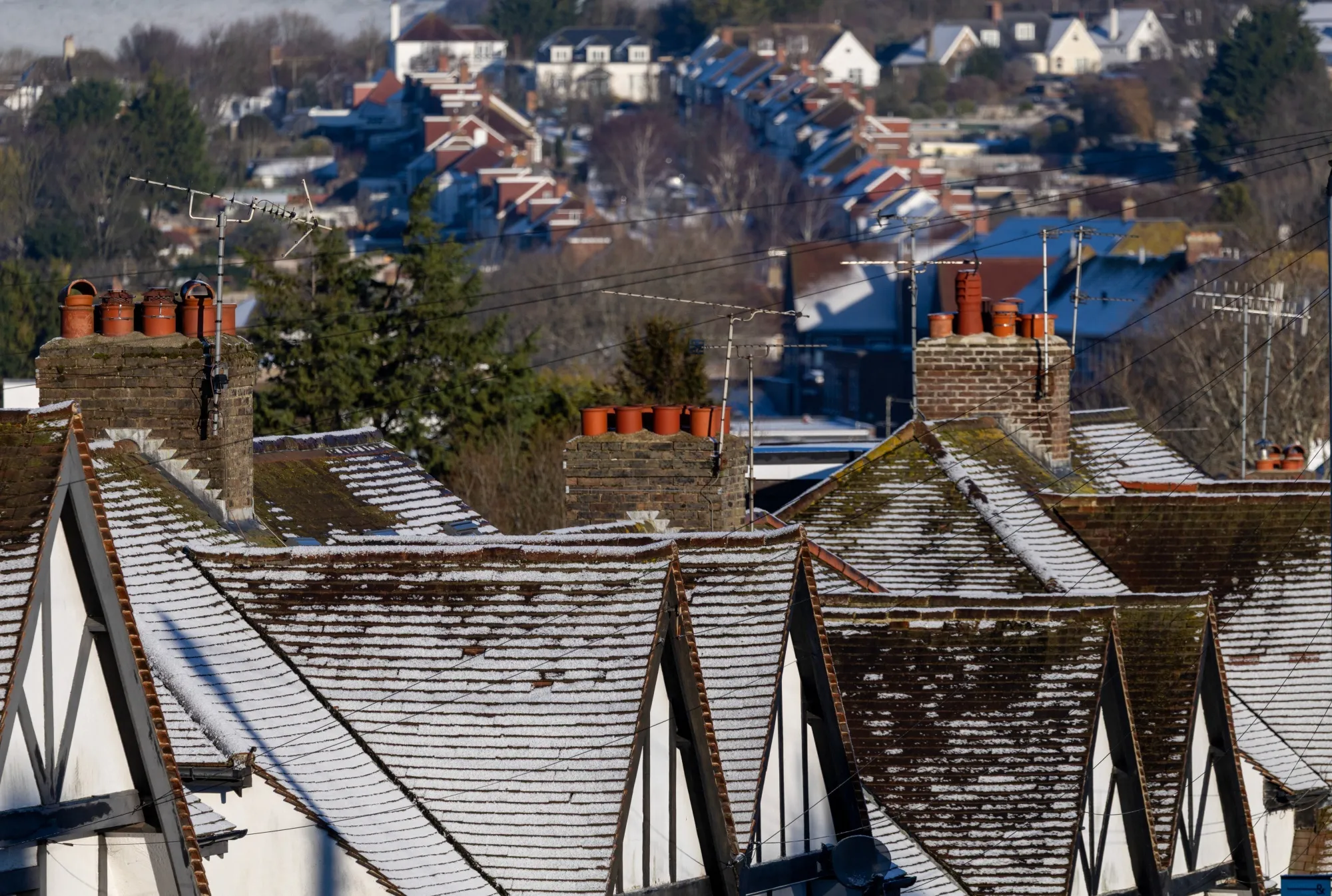 A dusting of snow on rooftops of residential houses in Brighton.