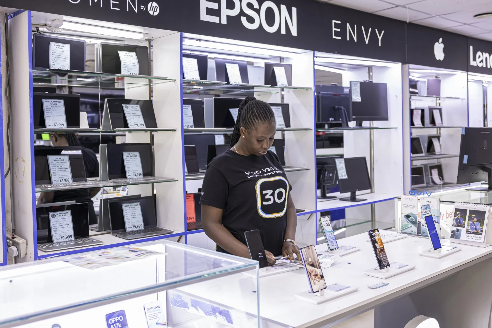 An employee works at a mobile phone store in&nbsp;Nairobi.