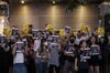 Demonstrators hold signs during a protest in the Causeway Bay district of Hong Kong, China, on Wednesday, Oct. 2, 2019. A Hong Kong police officer who fired a bullet into the chest of an 18-year-old protester may have inadvertently given new life to the months-long movement challenging Beijing's authority.