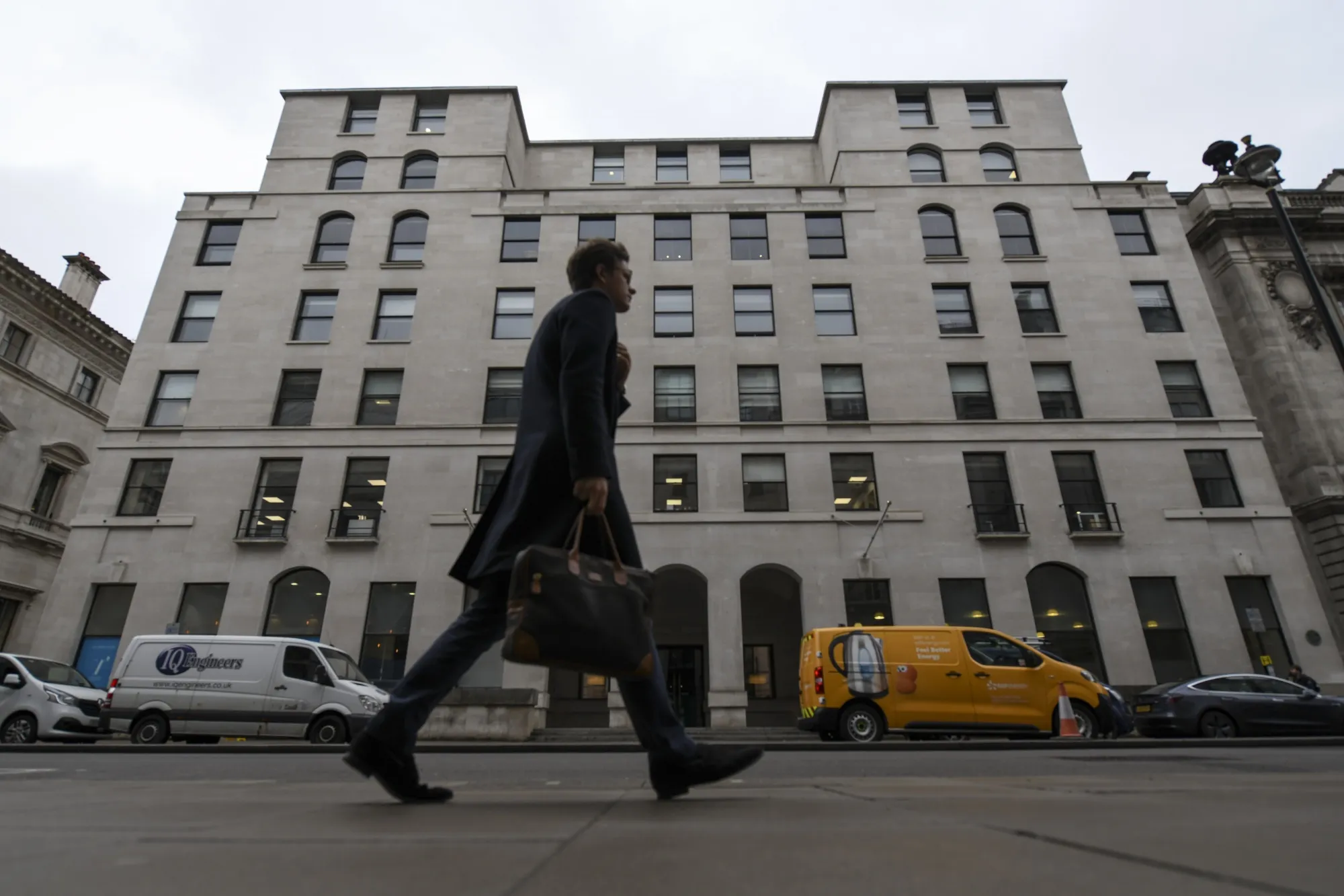 A pedestrian passes 100 Pall Mall, housing the offices of KKR &amp; Co., in London.