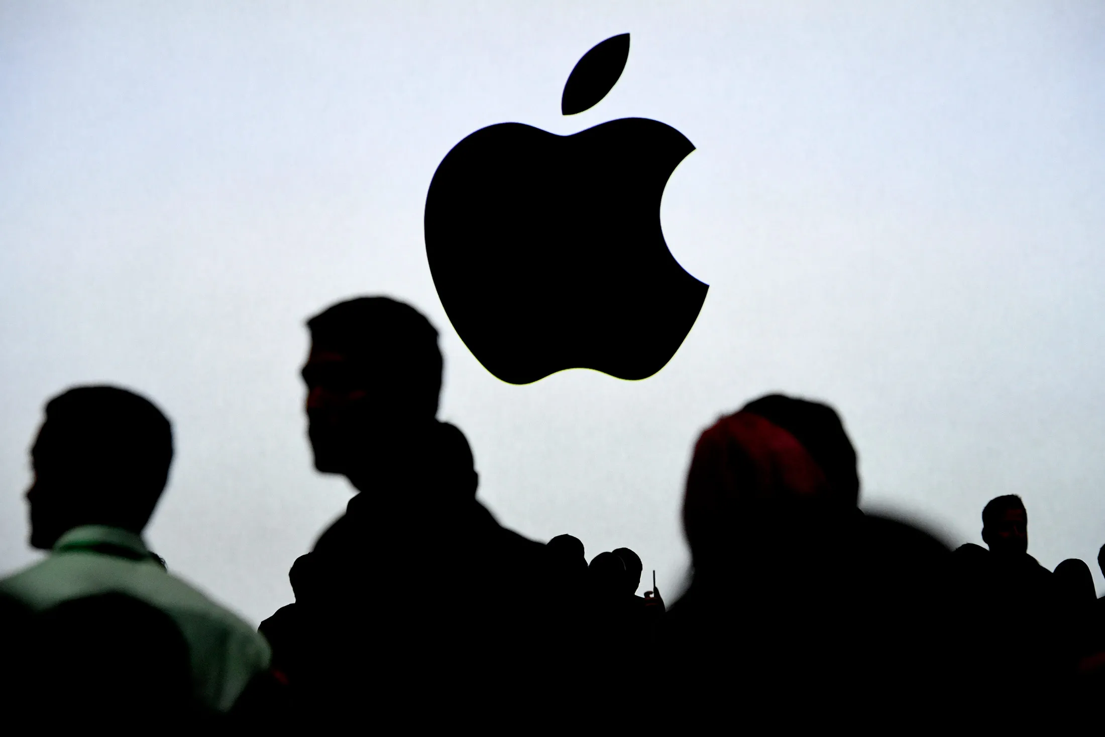 An Apple Inc. logo is displayed on a screen during the Apple Worldwide Developers Conference (WWDC) in San Jose, California, U.S., on Monday, June 5, 2017. The conference aims to inspire developers from around the world to turn their passions into the next great innovations and apps that customers use every day across iPhone, iPad, Apple Watch, Apple TV and Mac.