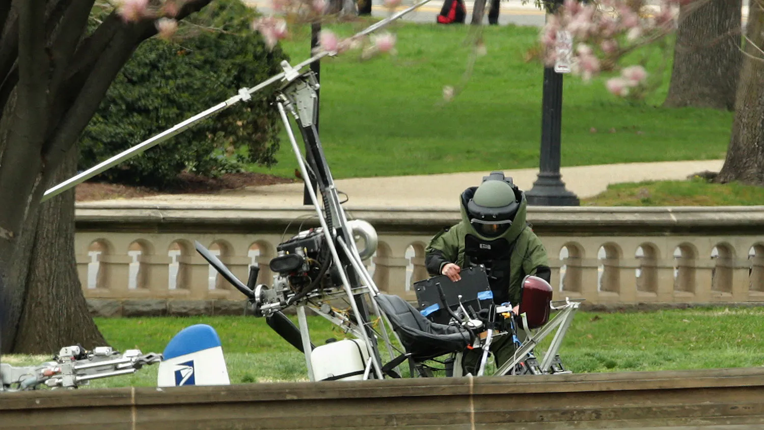 A member of the U.S. Capitol Police Bomb Squad works to check and secure a gyrocopter that landed on the West Front of the U.S. Capitol April 15, 2015 in Washington, DC.
