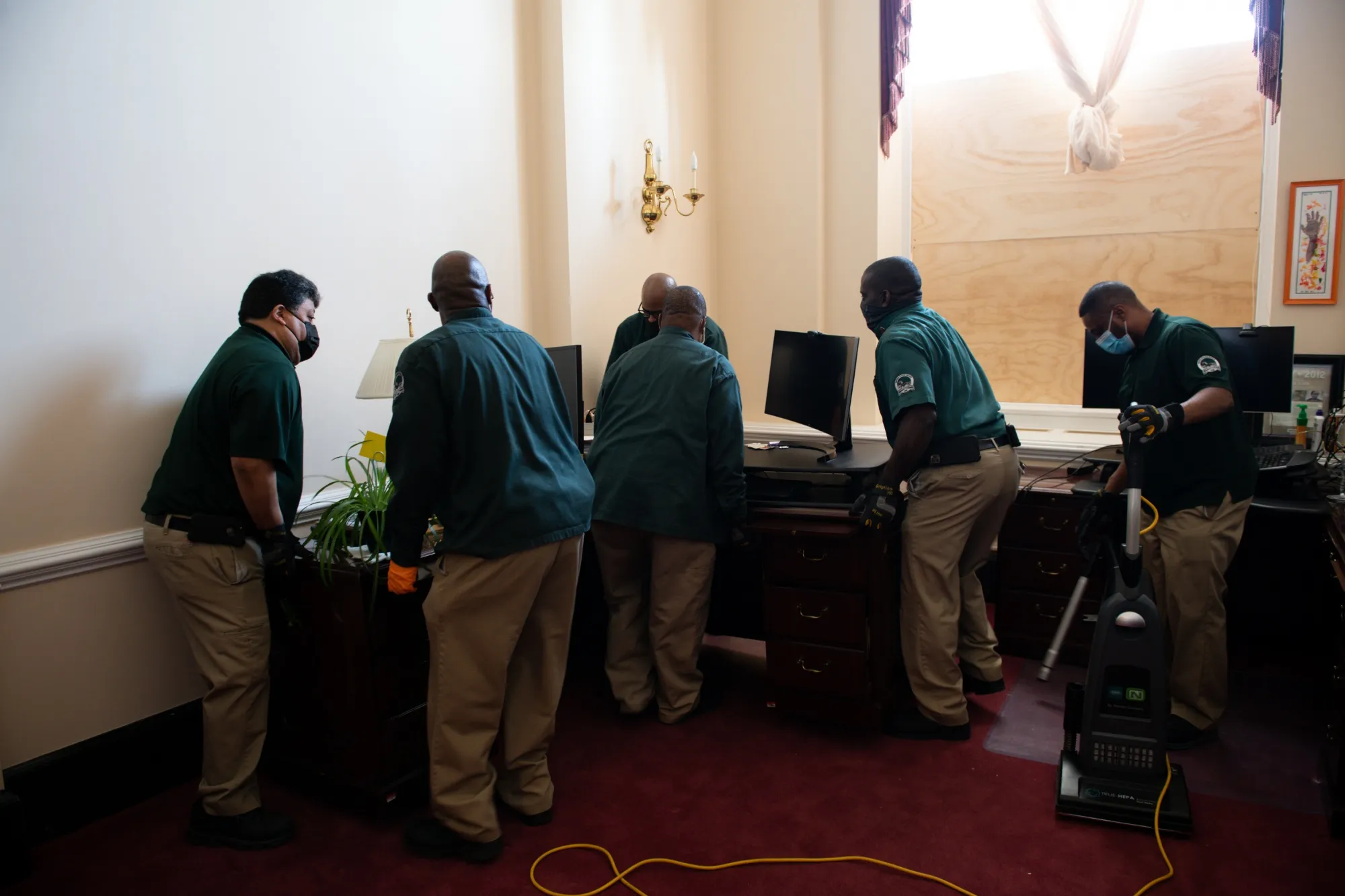 Workers clean an office at the U.S. Capitol building in Washington, D.C., on Jan. 7.