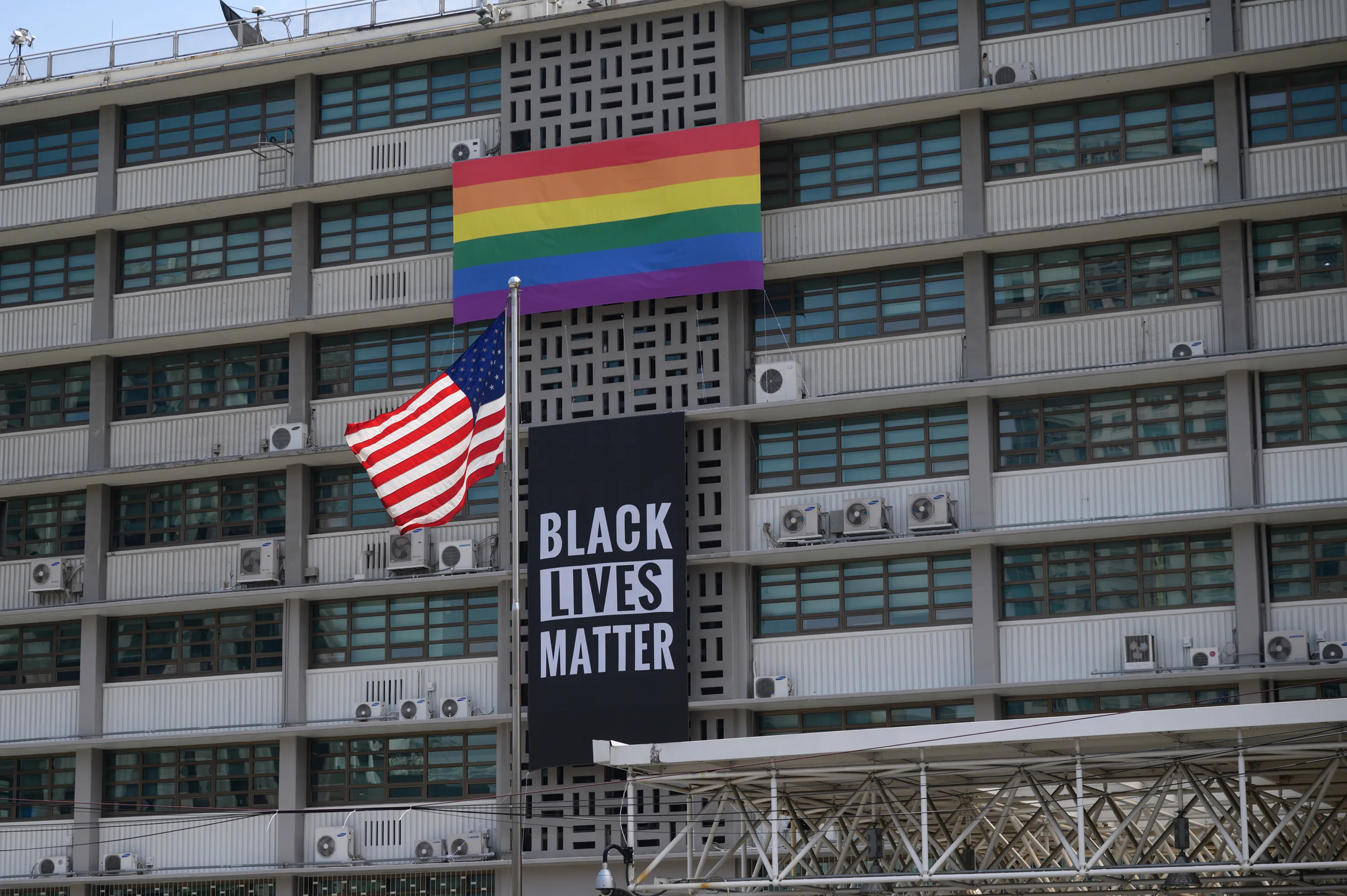 A 'Black Lives Matter' banner and pride flag are&nbsp;displayed on the U.S. embassy in Seoul on June 14.