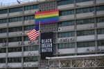 A 'Black Lives Matter' banner and pride flag are&nbsp;displayed on the U.S. embassy in Seoul on June 14.