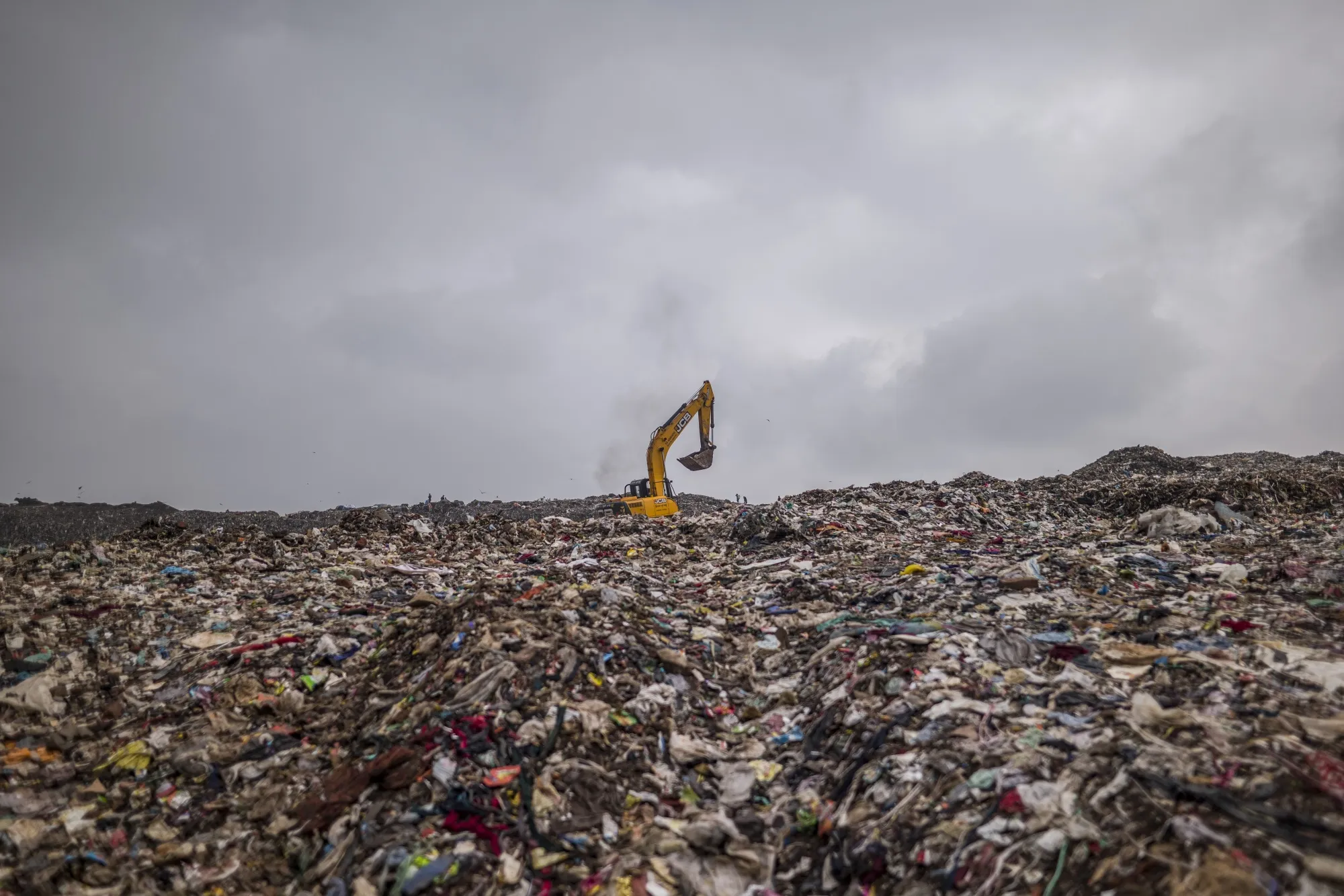 An excavator at the Ghazipur landfill in New Delhi.