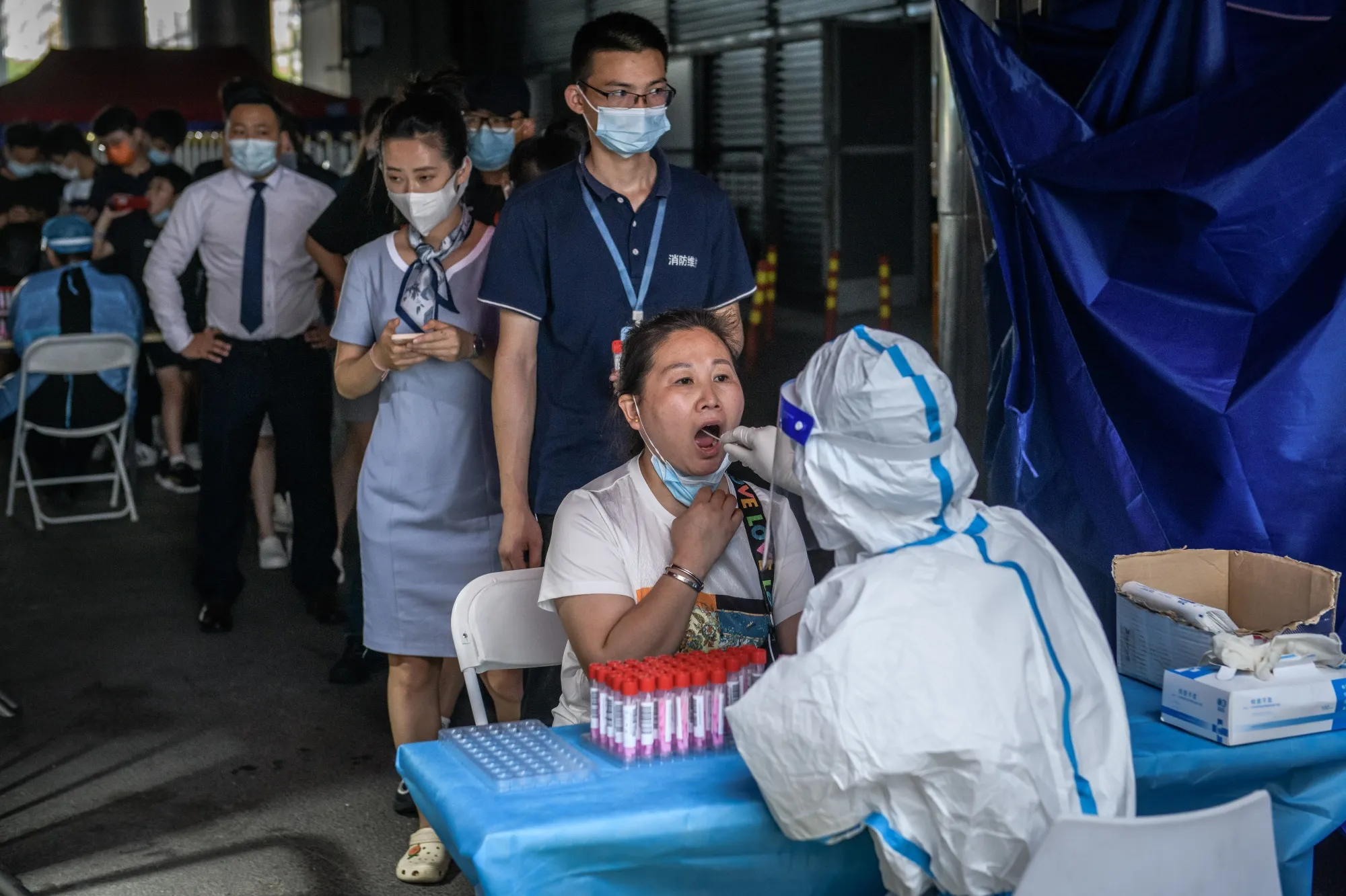 Residents in Shenzhen are tested for Covid-19 on June 6.