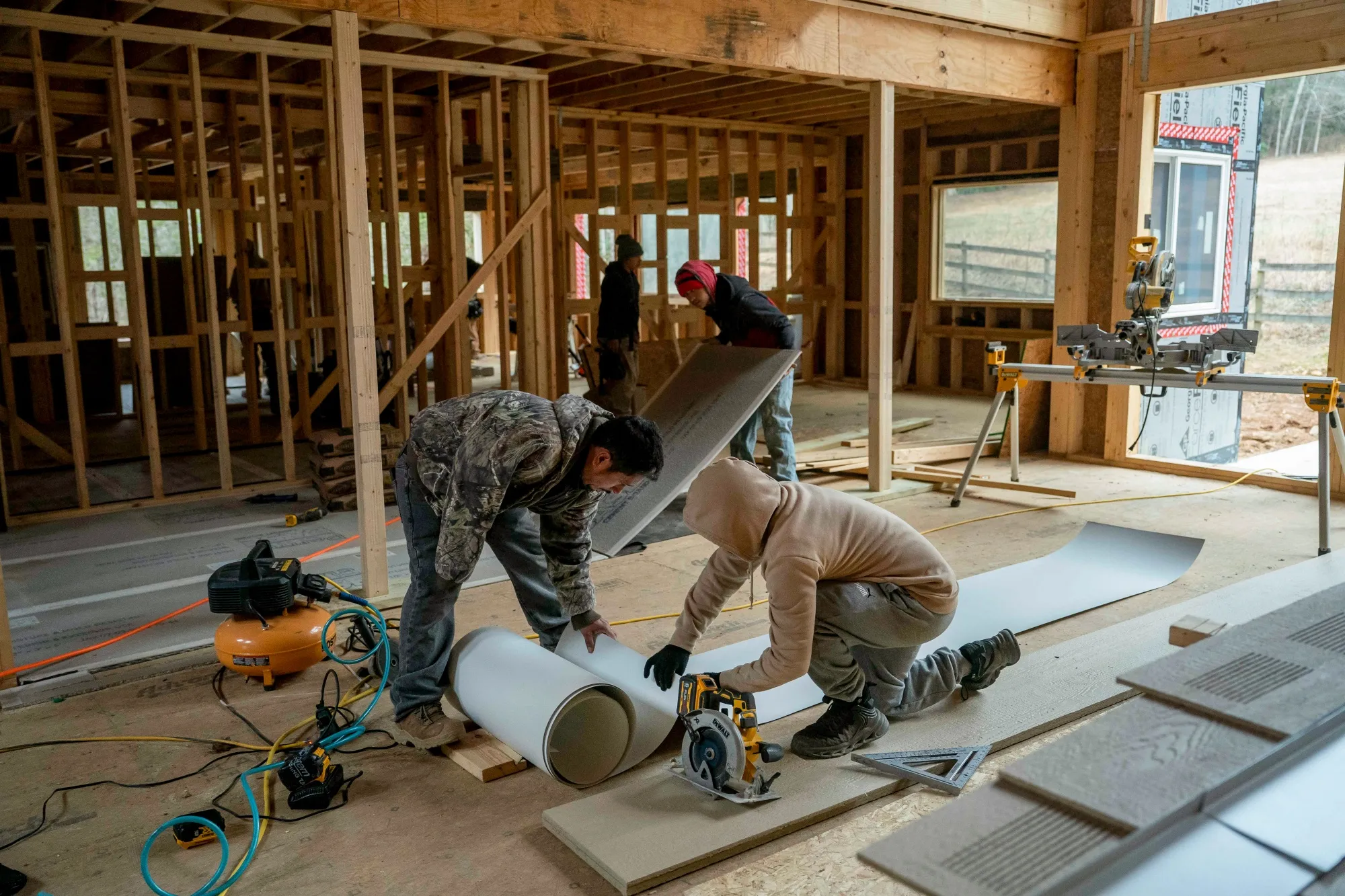 Workers build a house in Burnsville, North Carolina.