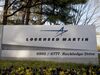Trees surround a sign for Lockheed Martin Corp. standing outside the company's headquarters in Bethesda, Maryland, U.S.
