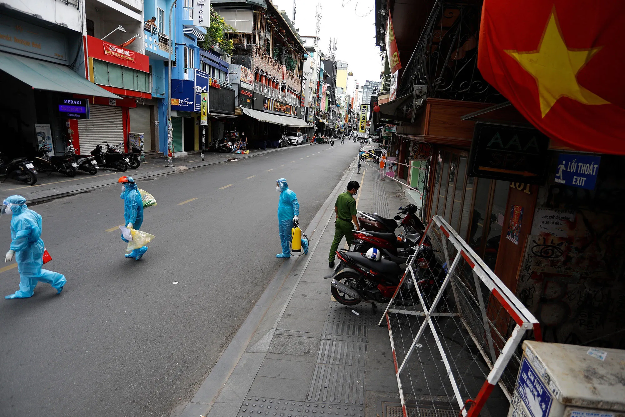 Health workers collect Covid-19 test samples from residents during restrictions in Ho Chi Minh City, Vietnam.