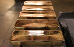 Freshly cast gold ingot bars sit in the foundry at the JSC Krastsvetmet non-ferrous metals plant in Krasnoyarsk, Russia, on Tuesday, Nov. 5, 2019. Gold headed for the biggest weekly loss in more than two years as progress in U.S-China trade talks hammered demand for havens and sent miners’ shares tumbling.