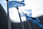 European Union&nbsp;flags fly&nbsp;outside the Berlaymont building in Brussels, Belgium.