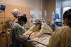 Healthcare workers prepare to prone a patient in the Covid-19 ICU overflow area at a hospital in Mission Hills, California, on Feb. 5.