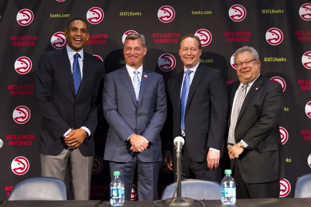 Grant Hill , from left, Tony Ressler, Mike Budenholzer, former coach of the Atlanta Hawks, and Steve Koonin during a news conference to announce the sale of the NBA basketball team to an ownership group led by Ressler, in 2015.