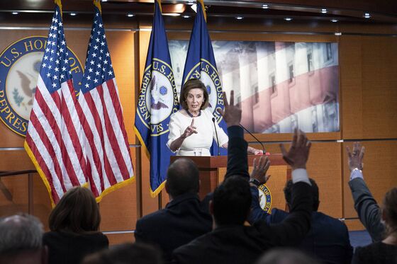 Pelosi Tries to Herd Democrats Toward Vote on Biden Agenda