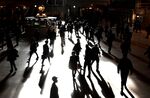 Commuters walk through Grand Central Terminal in New York City.