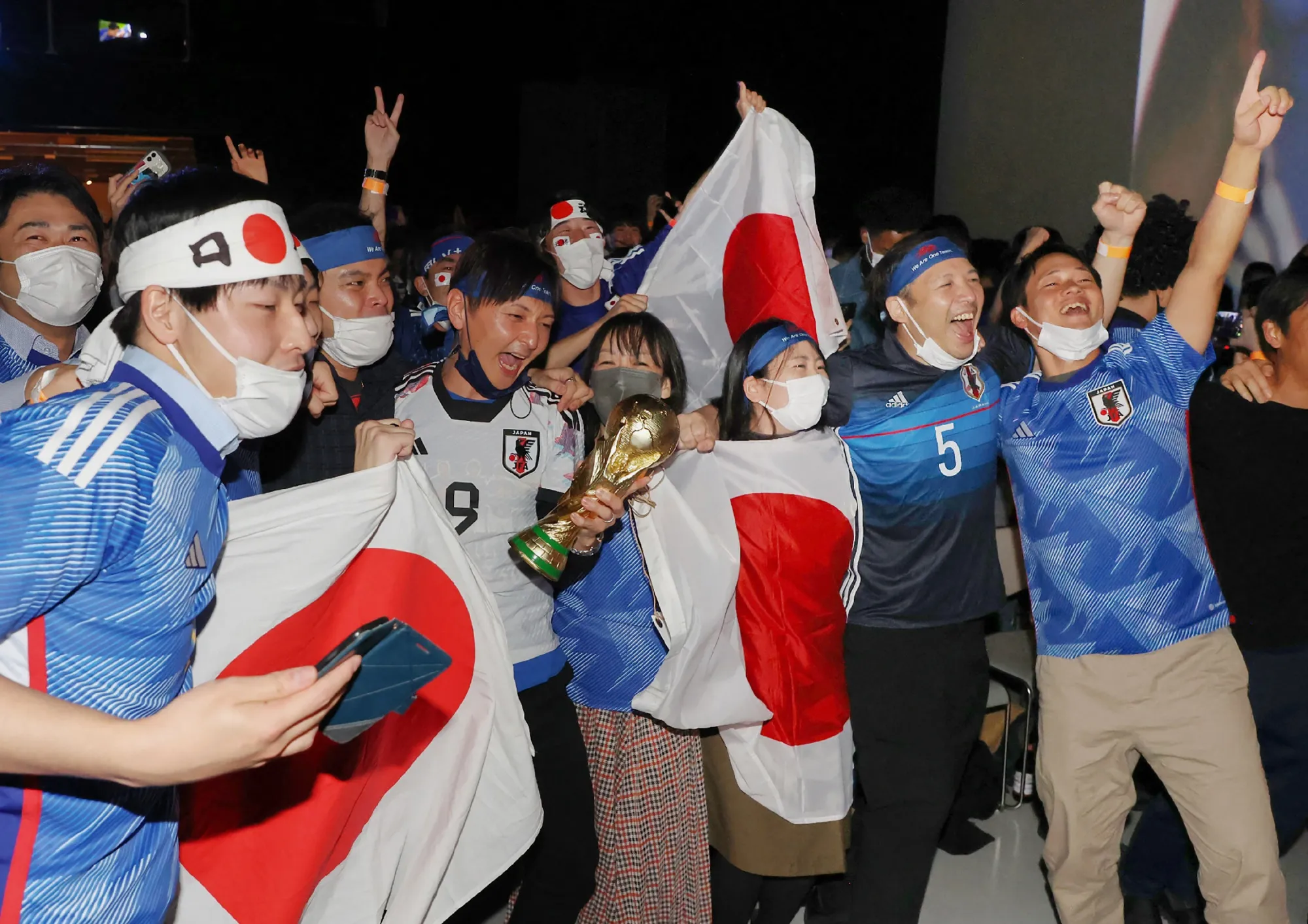Fans celebrate after Japan's victory over Spain in the Qatar 2022 World Cup,&nbsp;in Tokyo on Dec. 2.