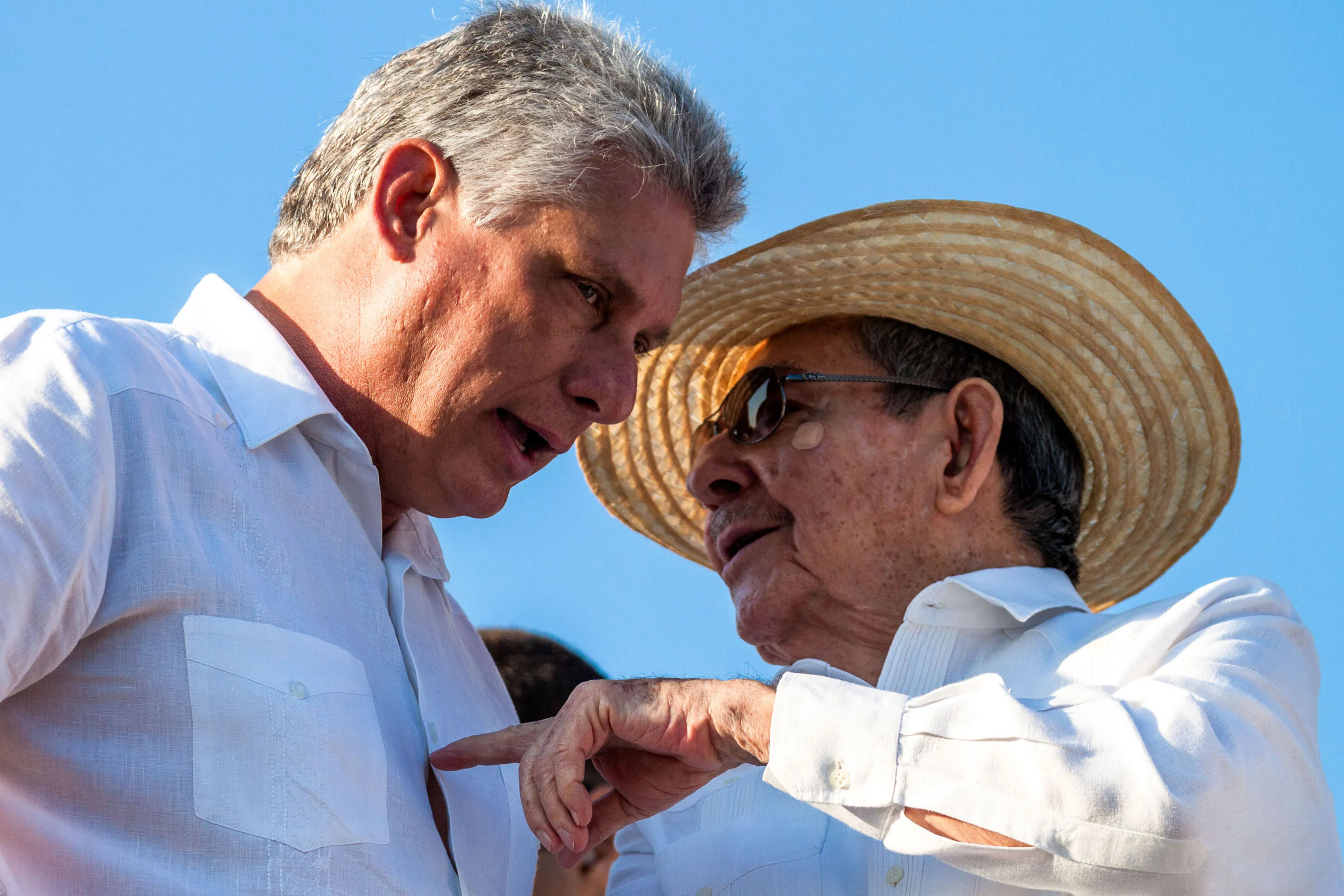 Cuban leader Raúl Castro (right) talks with&nbsp;Vice President Miguel Díaz-Canel while watching a parade in Havana’s Revolutionary Square on May 1, 2016.&nbsp;