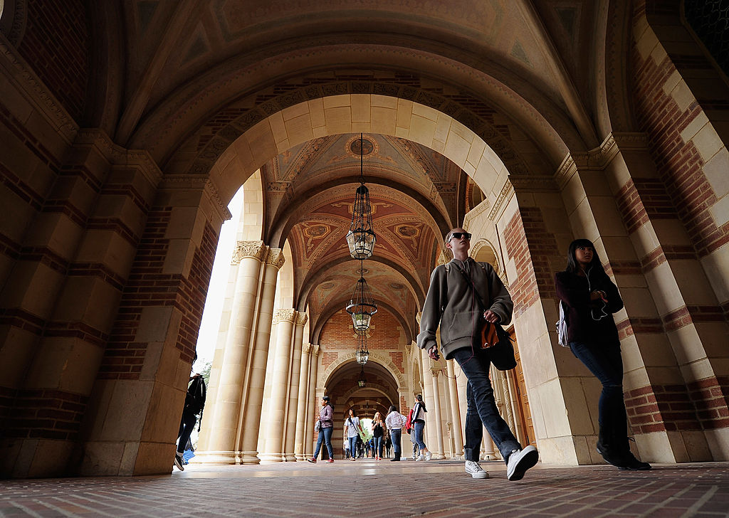 Students walk near Royce Hall on the campus of UCLA.