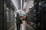A pedestrian walks through the Ameya Yokocho market in the Ueno District of Tokyo, Japan, on Friday, July 2, 2021.