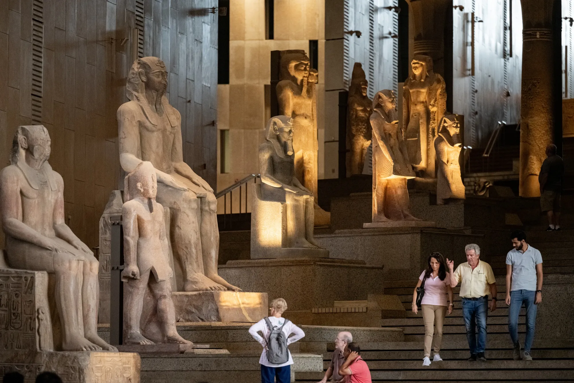 Ancient Egyptian colossal statues on the Grand Staircase inside the museum.