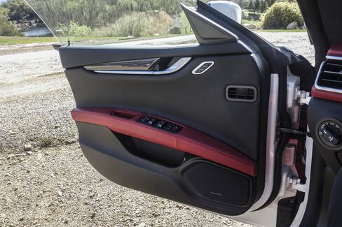 The interior of the car is beautifully appointed in red.