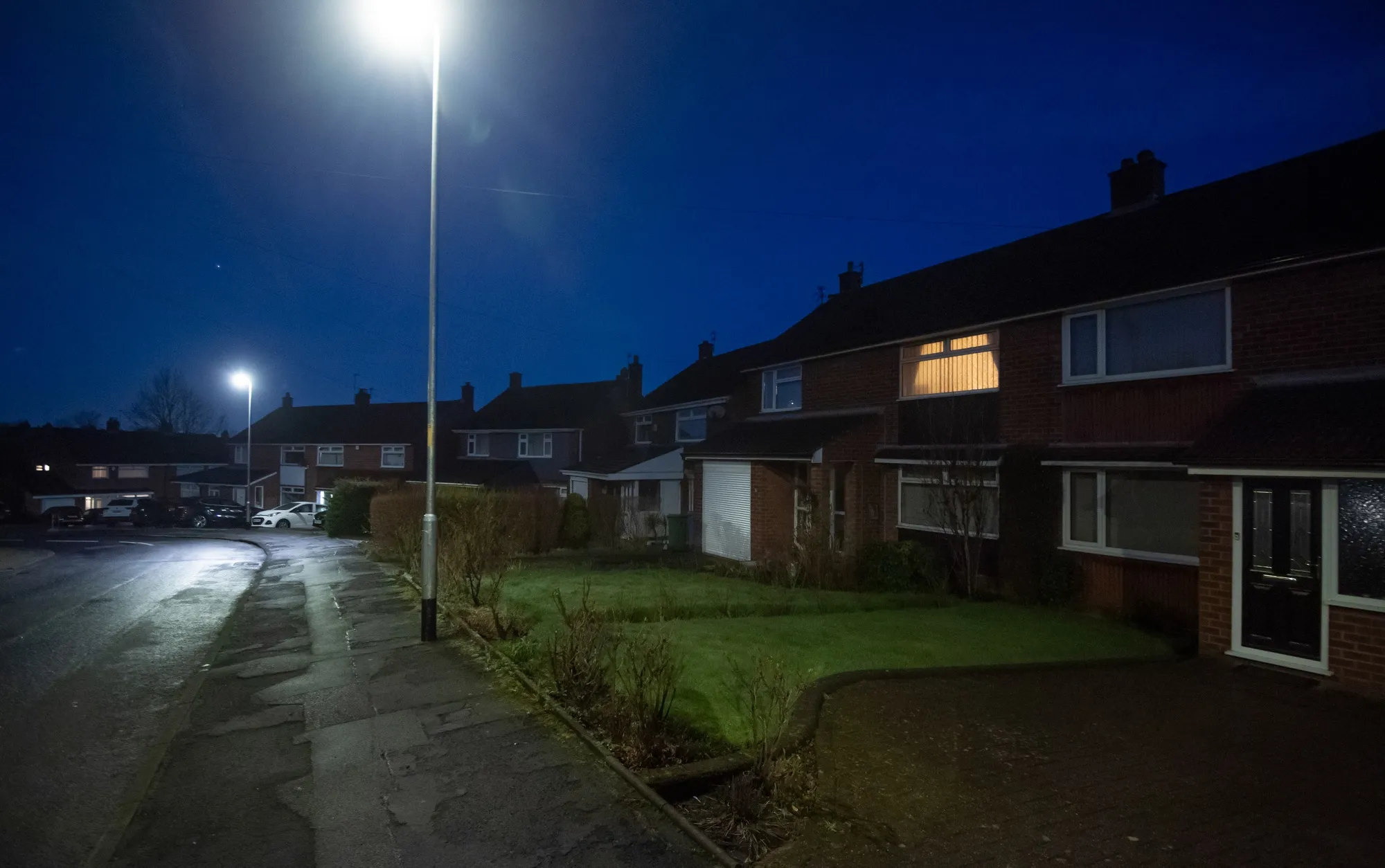A light on at a residential house at dawn in the Stalybridge district of Greater Manchester.&nbsp;