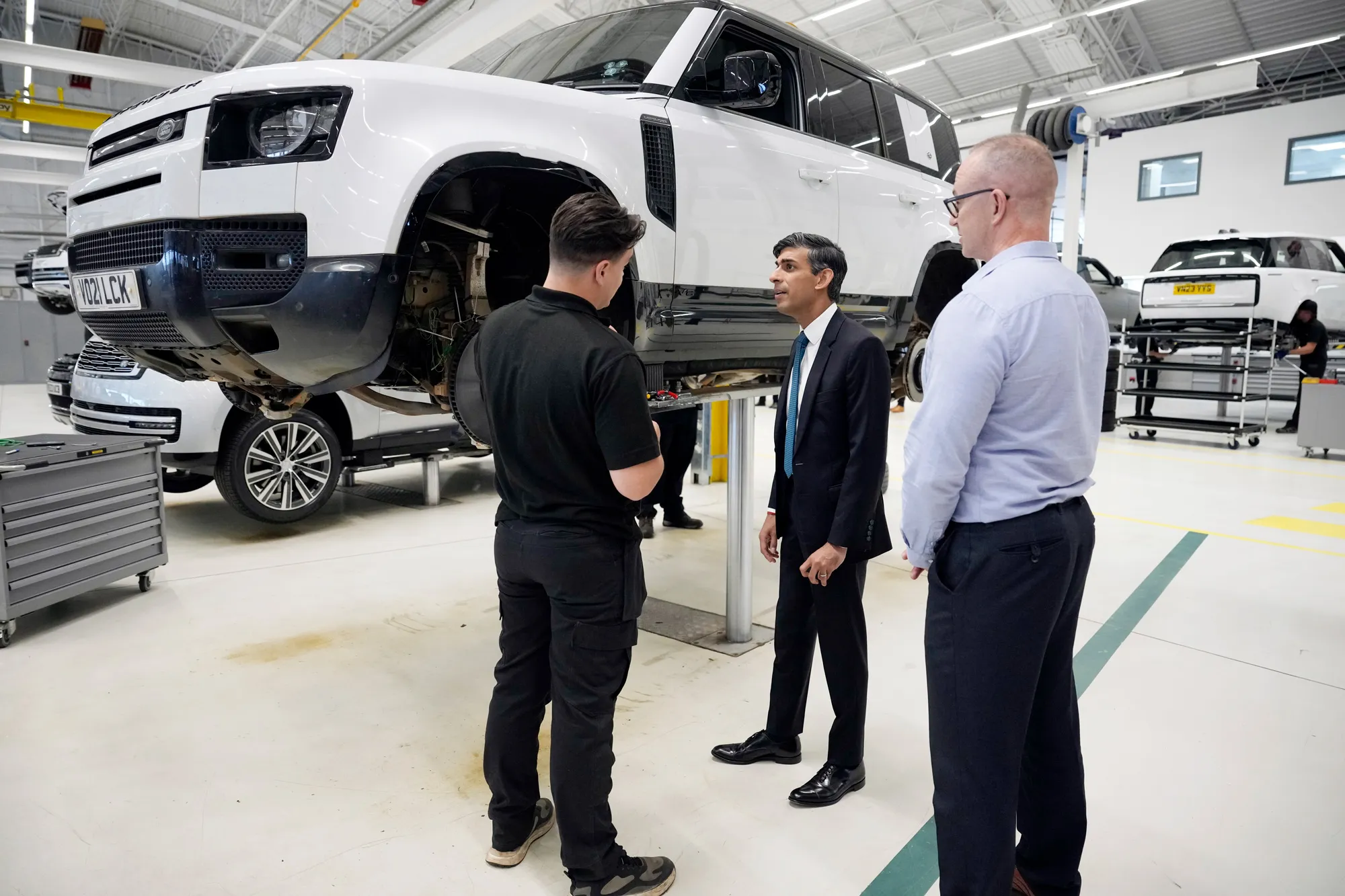 Rishi Sunak, center, visits the JLR plant in Warwickshire, UK, on July 19.