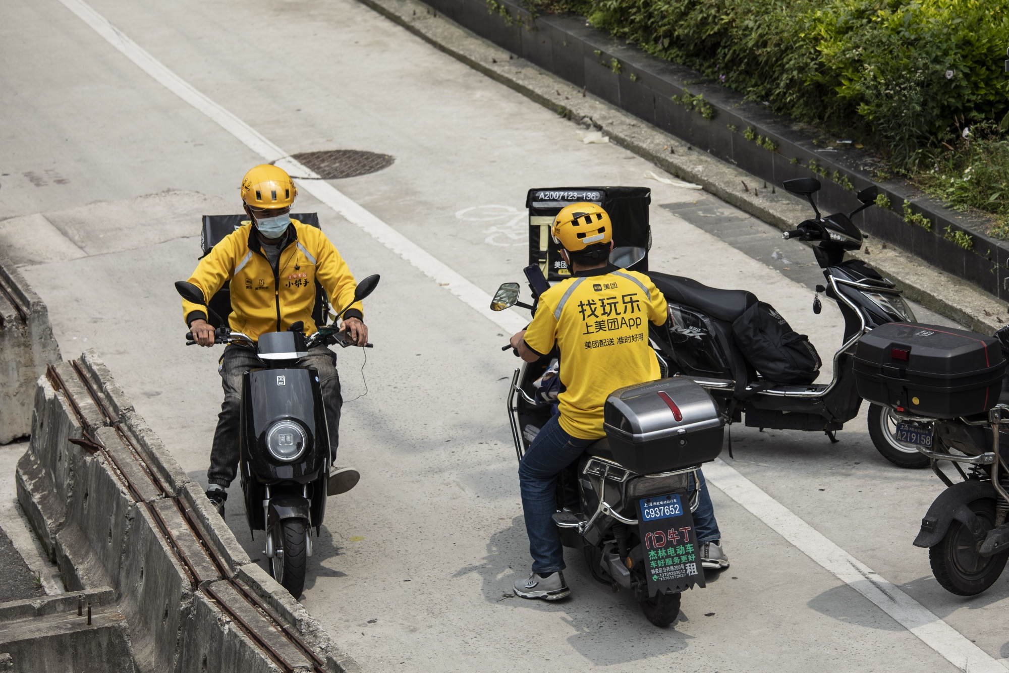 Delivery workers for Meituan in Shanghai, China.