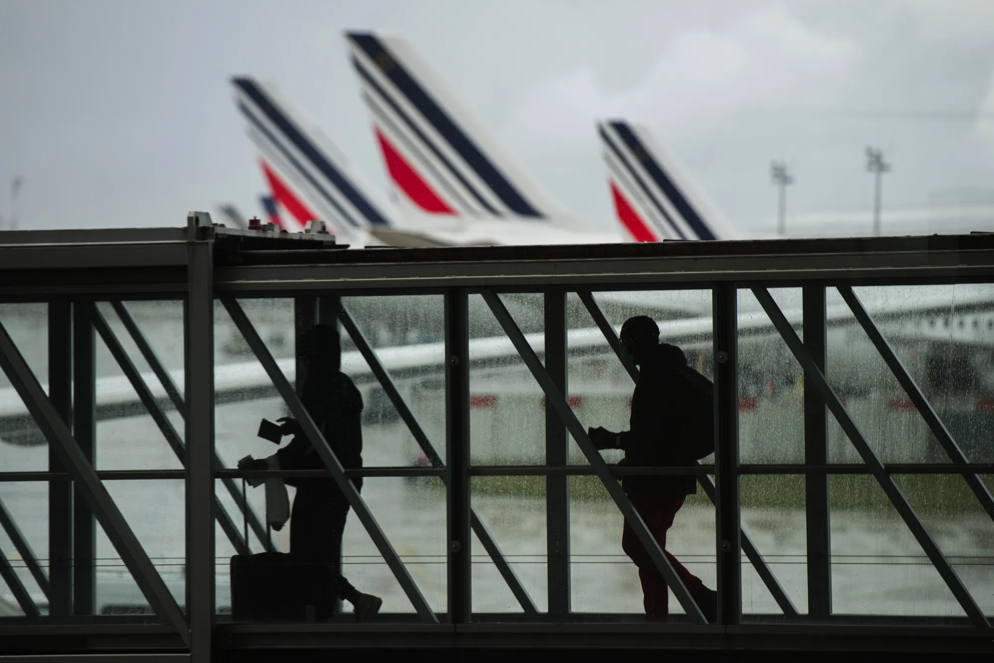 Travelers at Charles de Gaulle airport.