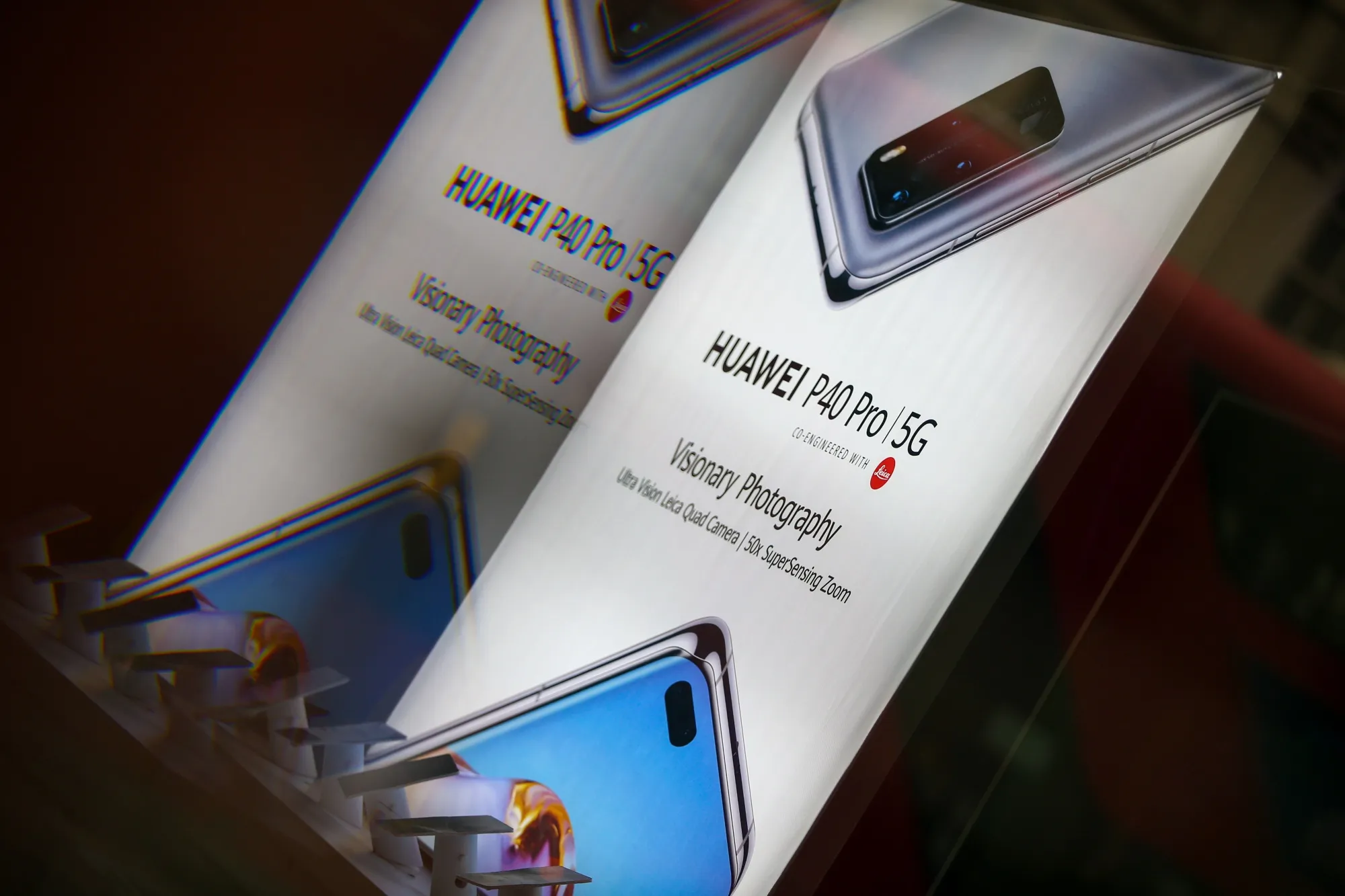 An advertisement for a Huawei P40 Pro 5G mobile phone.