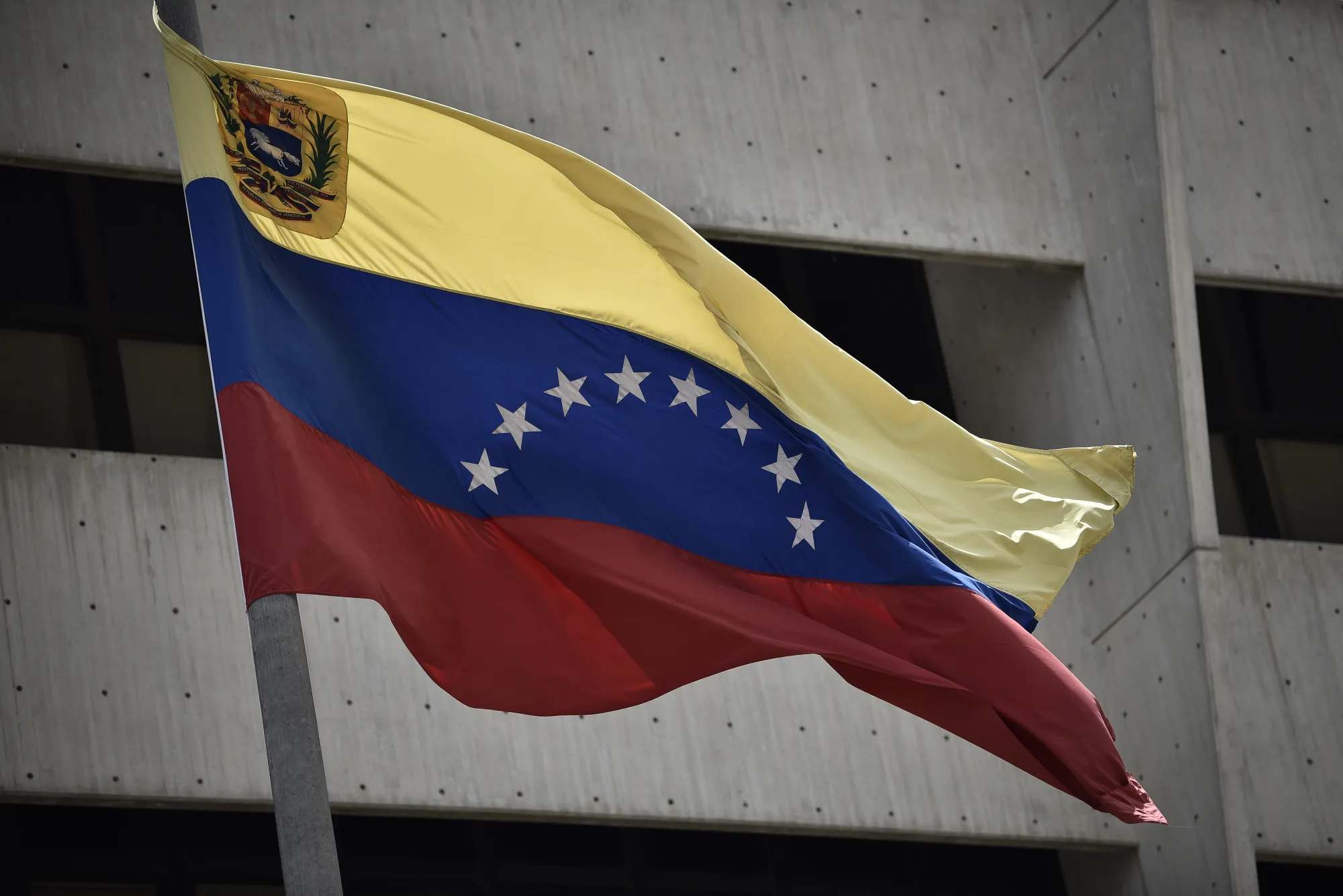 The Venezuelan flag flies outside the Supreme Court in Caracas, Venezuela.
