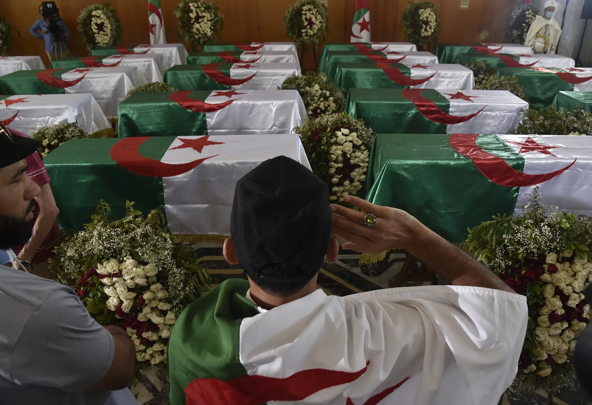 Coffins containing the remains of 24 Algerian resistance fighters are presented at the Palais De La Culture Moufdi Zakaria in Algiers, Algeria, on July 4.