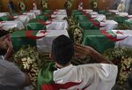 Coffins containing the remains of 24 Algerian resistance fighters are presented at the Palais De La Culture Moufdi Zakaria in Algiers, Algeria, on July 4.