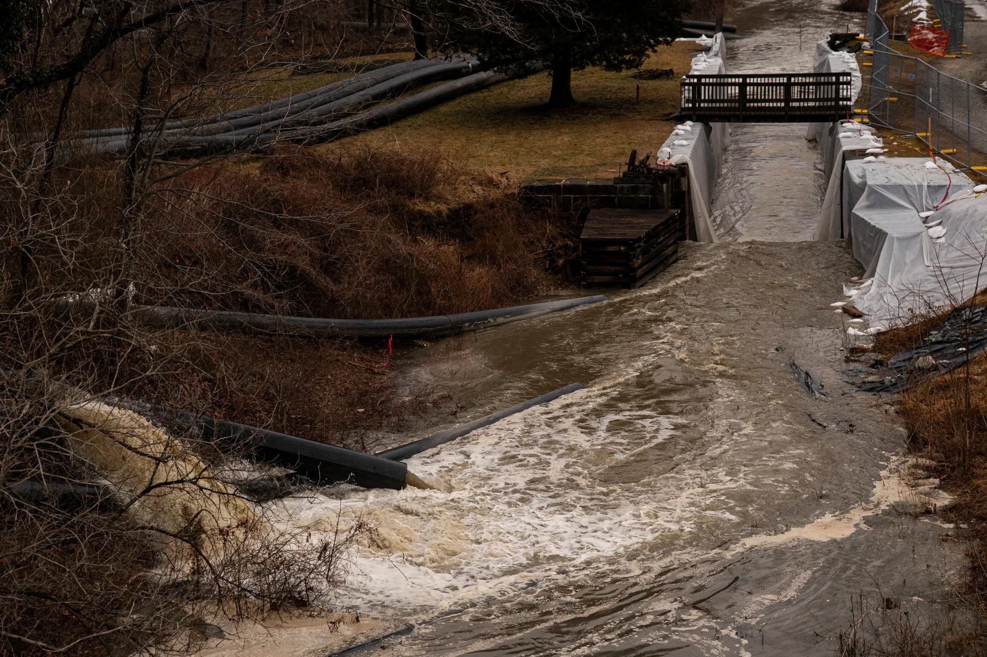 Pumps and pipes divert raw sewage into the C&amp;O Canal and around a broken section of the Potomac Interceptor, a six-foot-wide sewage pipe between the Clara Barton Parkway and the C&amp;O Canal, in Cabin John, Maryland on Feb. 20.