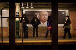 An image of Vladimir Putin at the Wall Street subway station in New York.