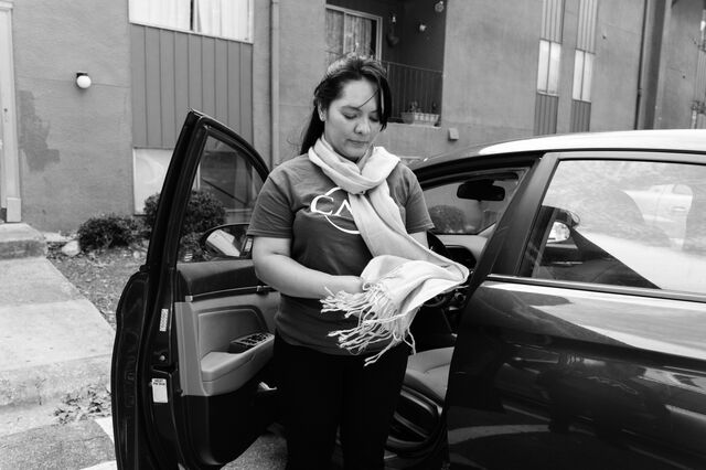 Ovares exits her car wearing a scarf given to her by her grandmother in Costa Rica. 