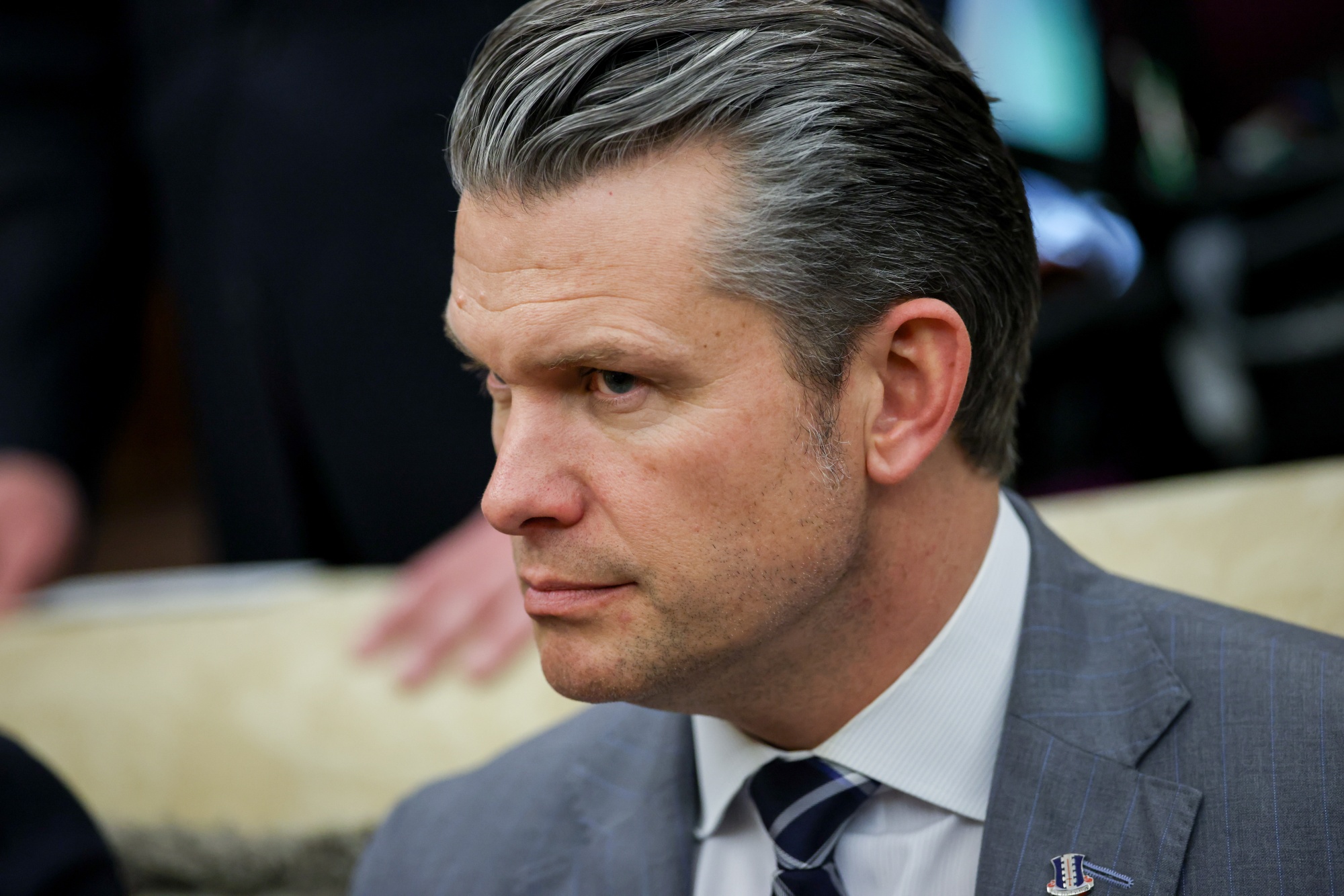 Pete Hegseth, US secretary of defense, during a meeting with US President Donald Trump and German Chancellor Friedrich Merz, not pictured, in the Oval Office of the White House in Washington, DC, US, on Tuesday, March 3, 2026. Merz said he intended to discuss with President Donald Trump the next steps in the war on Iran amid questions about the US administration's endgame after it launched strikes on the Islamic Republic. Photographer: Samuel Corum/Sipa/Bloomberg
