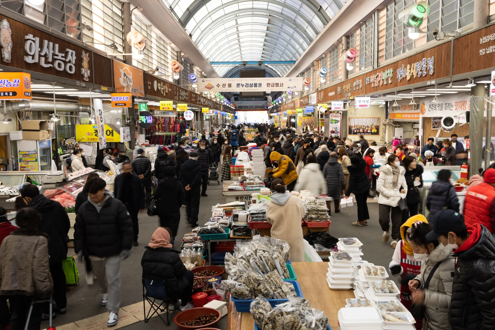 Customers walk through Jeonju New Joongang Market in Jeonju, North Jeolla Province, South Korea.